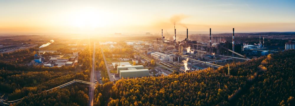 Air Emissions aerial photo of industrial mill site at sunset