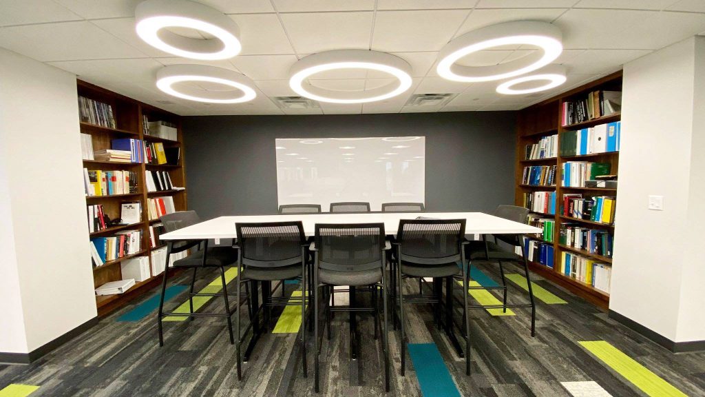 photo of chairs at a conference table in an office space