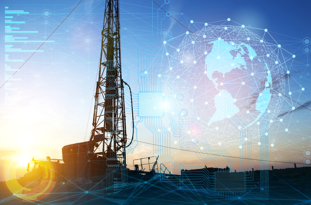 photo graphic of large technical equipment with charts and graphs and an earth graphic representing geophysics