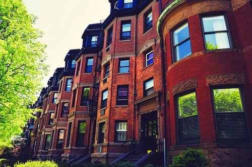 Capital Needs Assessments & Services photo of brick apartment buildings along a street