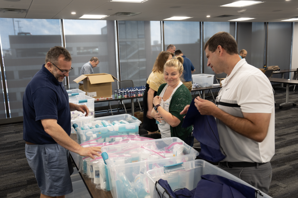 Haley Ward employee-owners participating in assembling veterans care packs at the Provision Ministry event. 